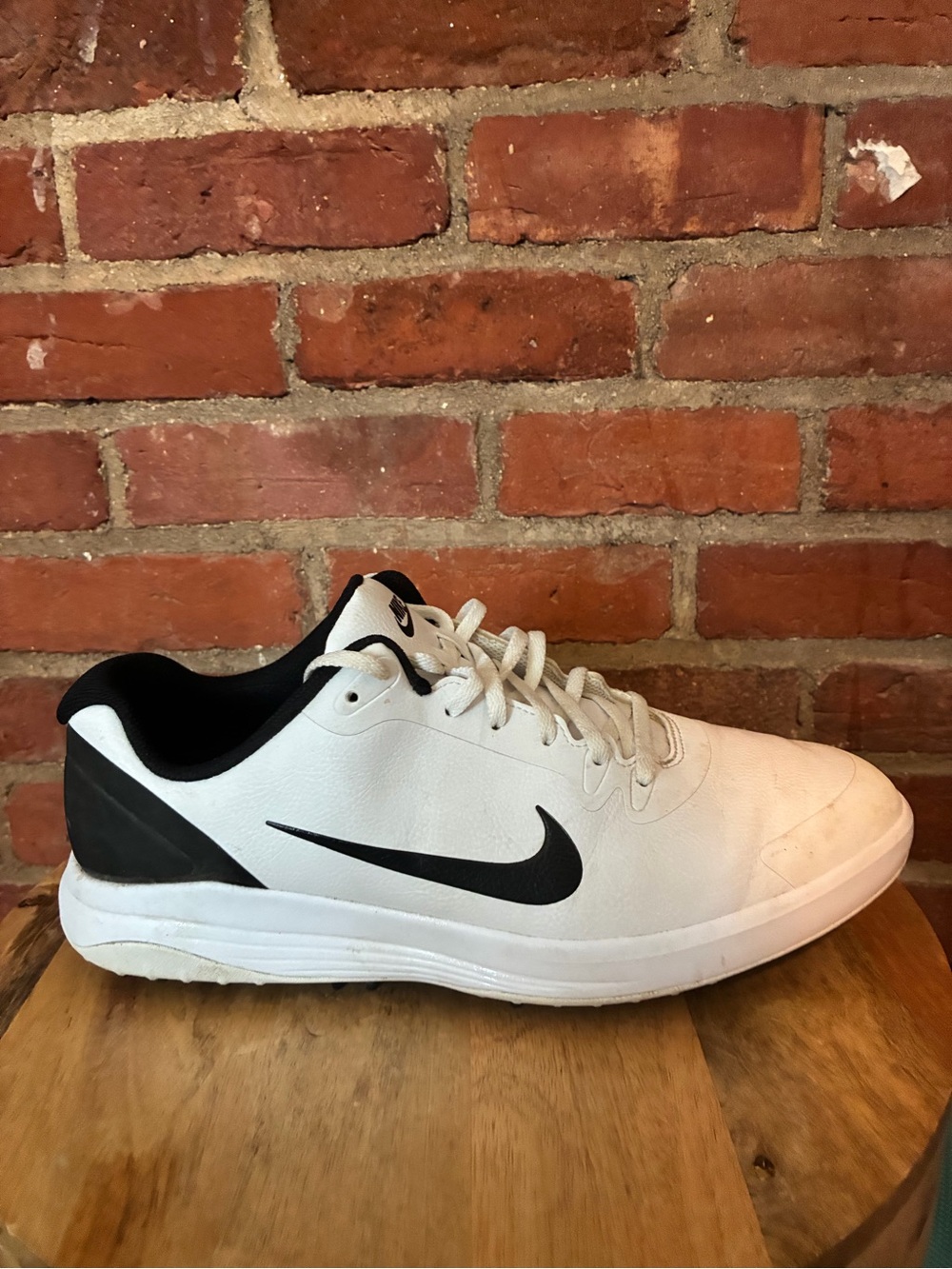Nike White and Black Low-Top Golf Sneaker.